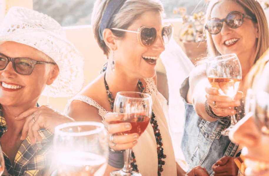 A group of people drinking wine.