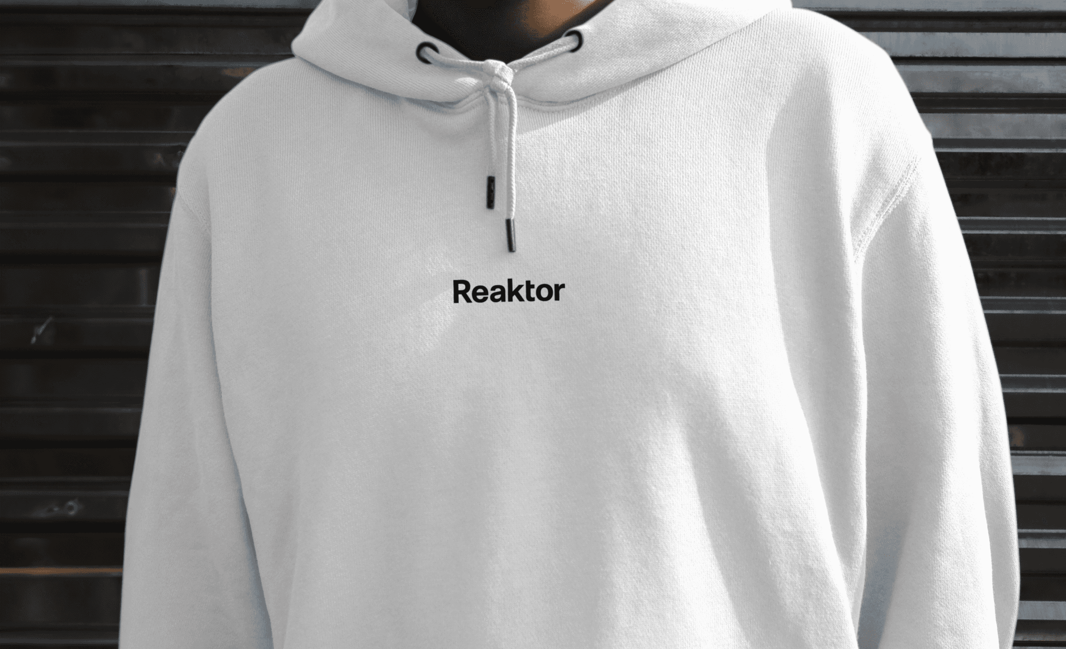 A white sweatshirt with Reaktor on it