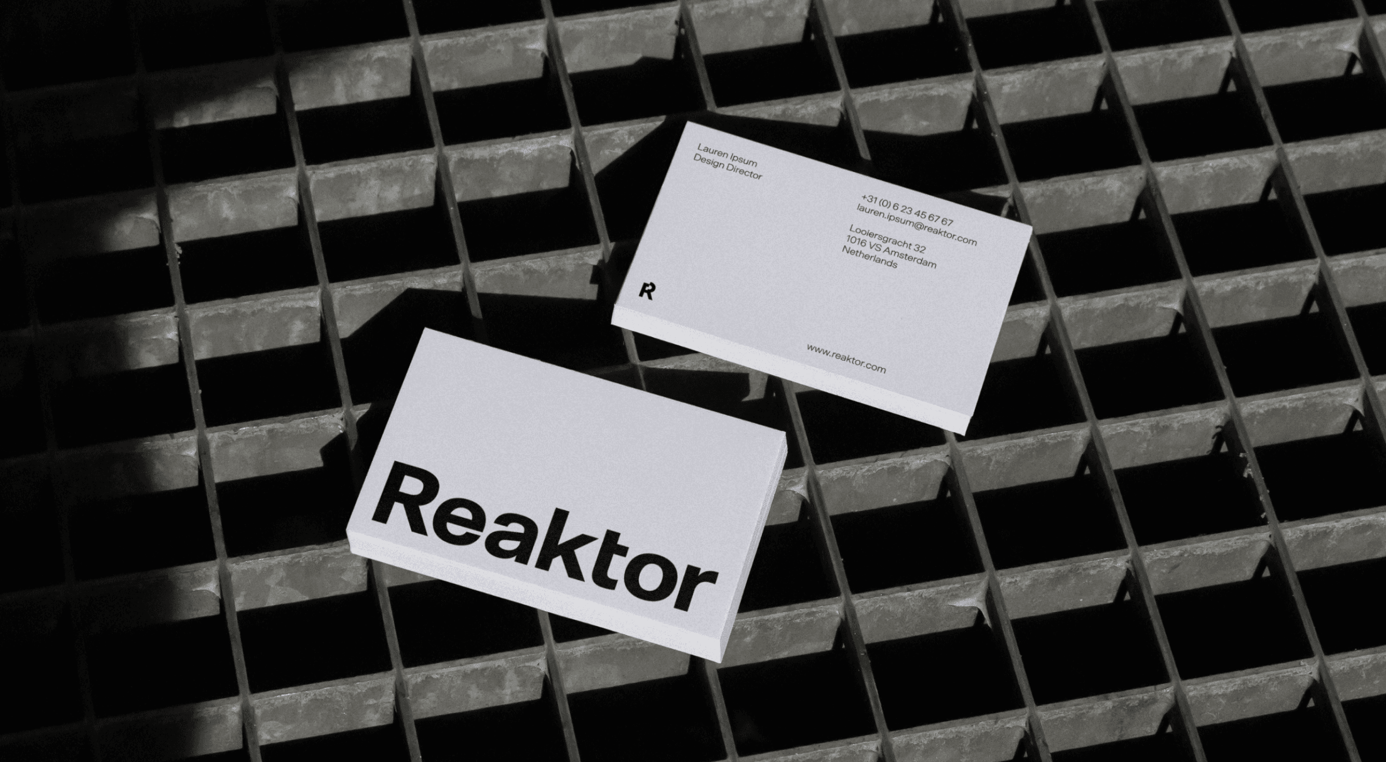 Two stacks of Reaktor business cards.