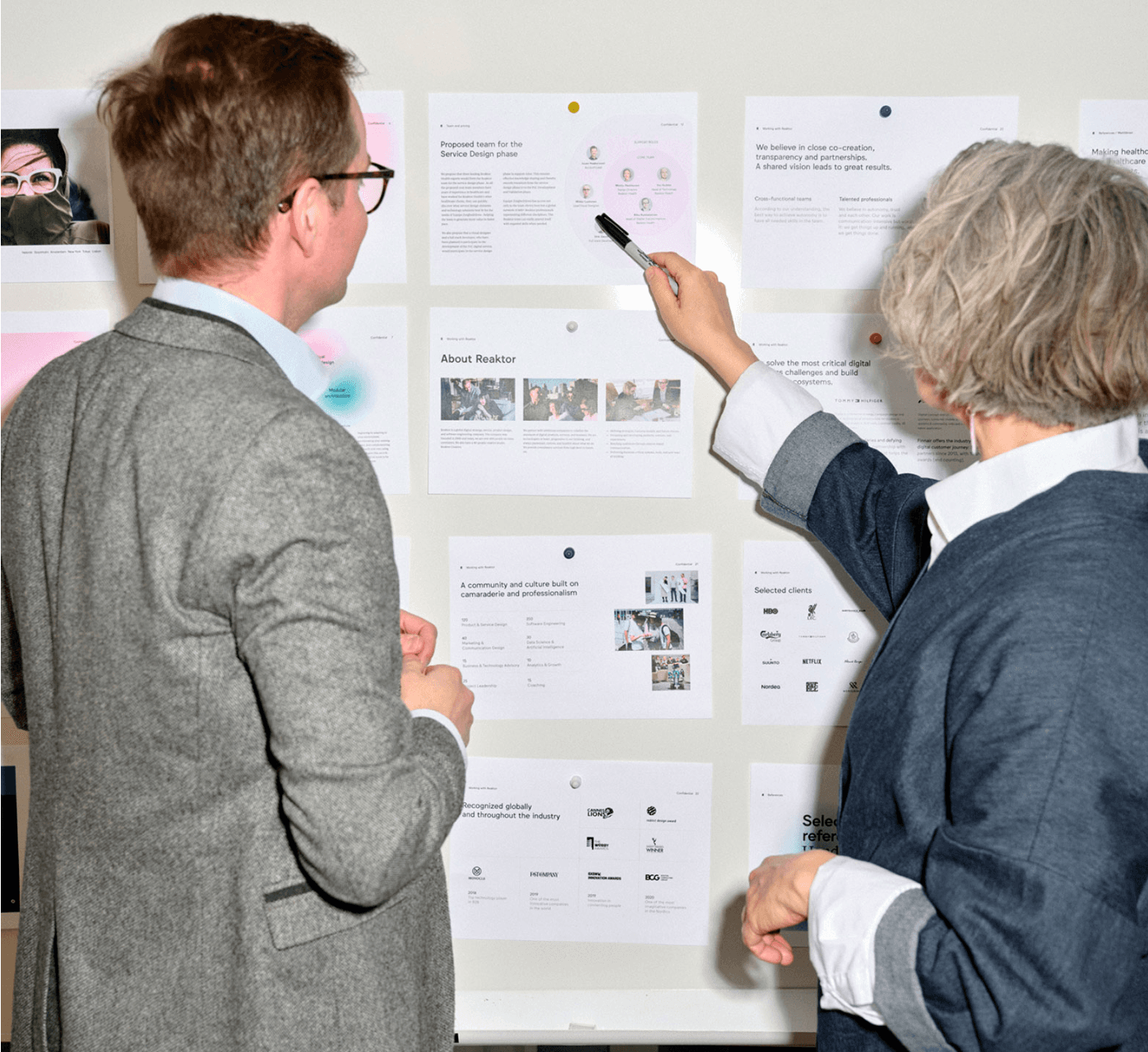 People looking at some documents.